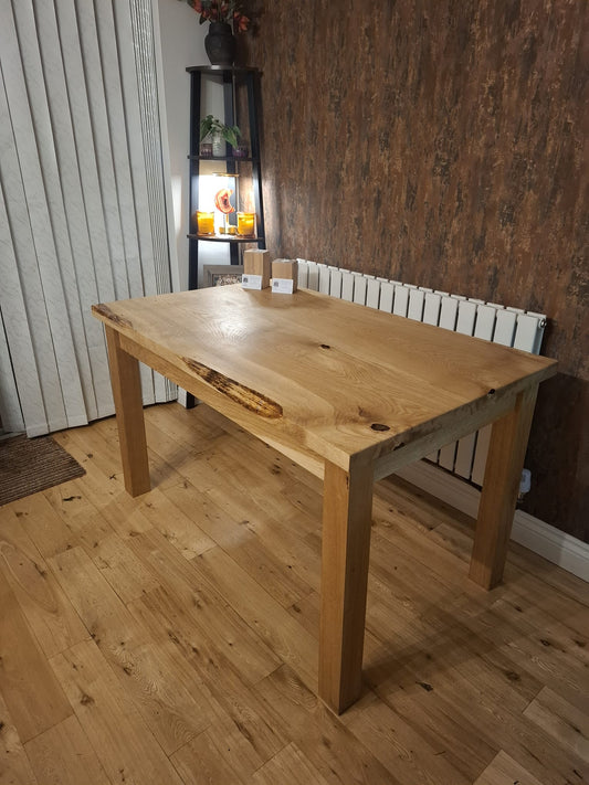 Solid oak table with a drop of resin